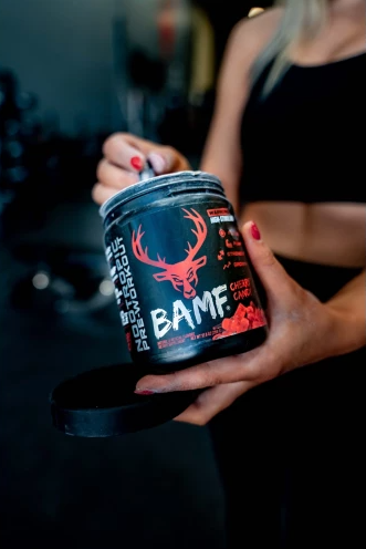 BAMF by Bucked Up pre-workout in a sleek tub, offering explosive energy, laser focus, and muscle pumps for the ultimate training performance.